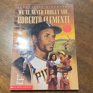 Scholastic Biography Paperback in Tan and Brown